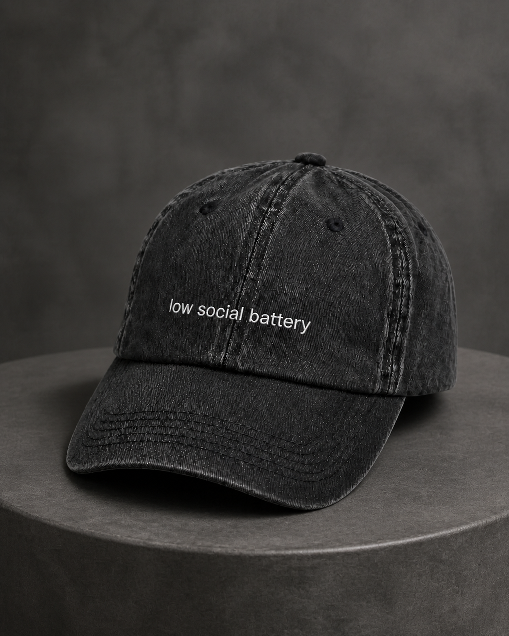 Low Social Battery cap in black — washed cotton dad hat with “low social battery” embroidered in white, product shot