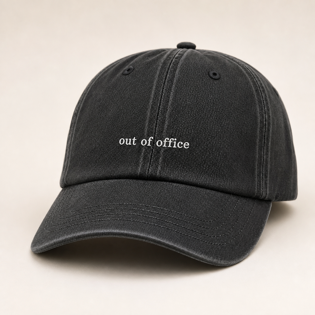 Black baseball cap with a textured pattern on a white background