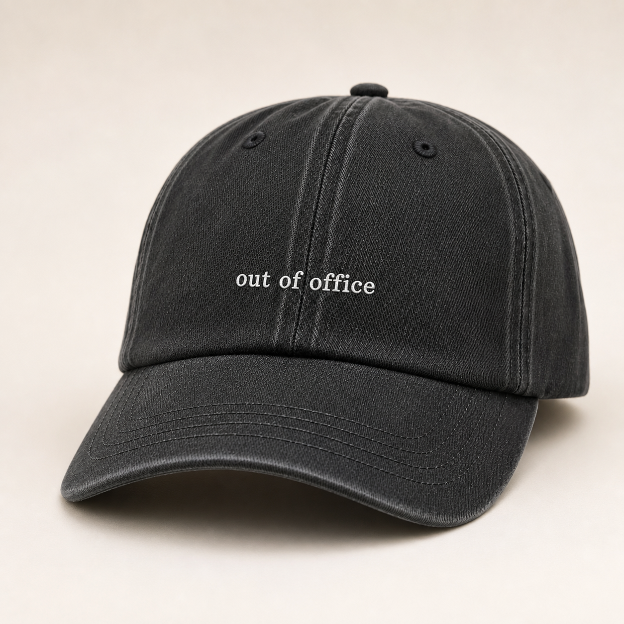 Black baseball cap with a textured pattern on a white background