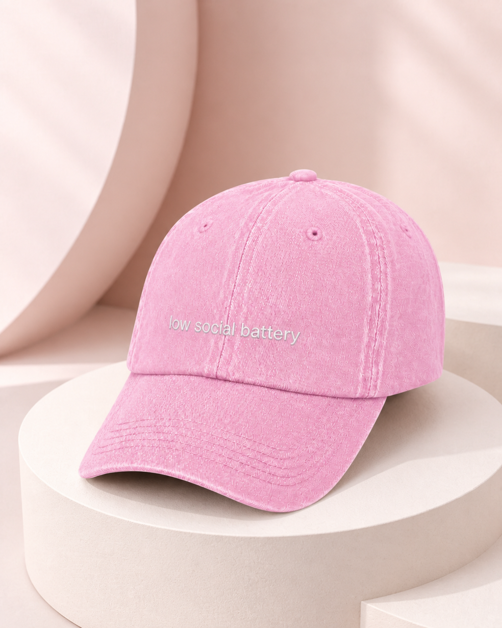 Low Social Battery cap in baby pink — washed cotton dad hat with “low social battery” embroidered in white, product shot
