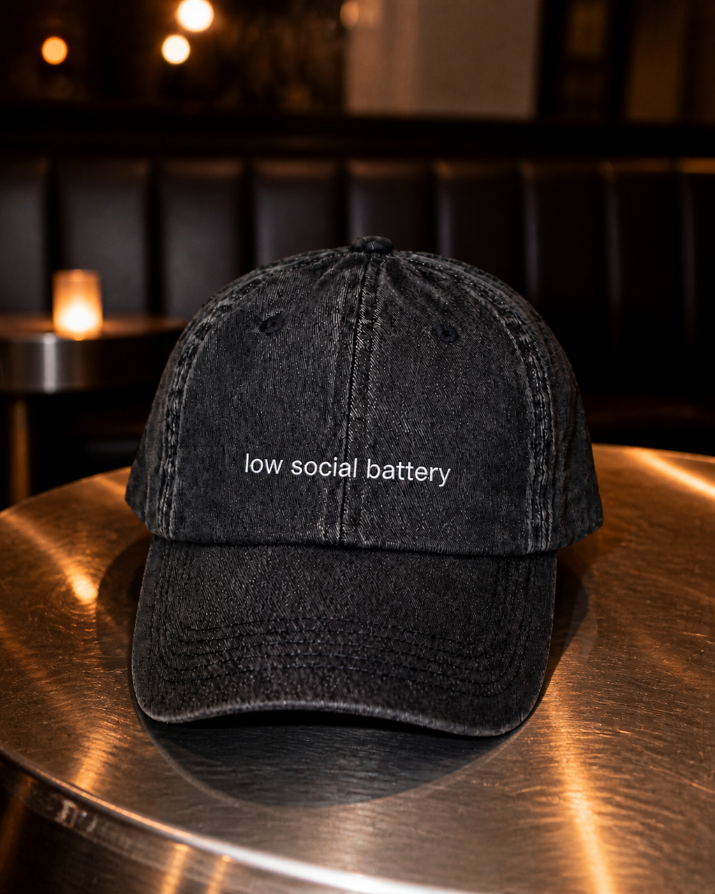 Low Social Battery cap in black — washed cotton dad hat with “low social battery” embroidered in white, worn