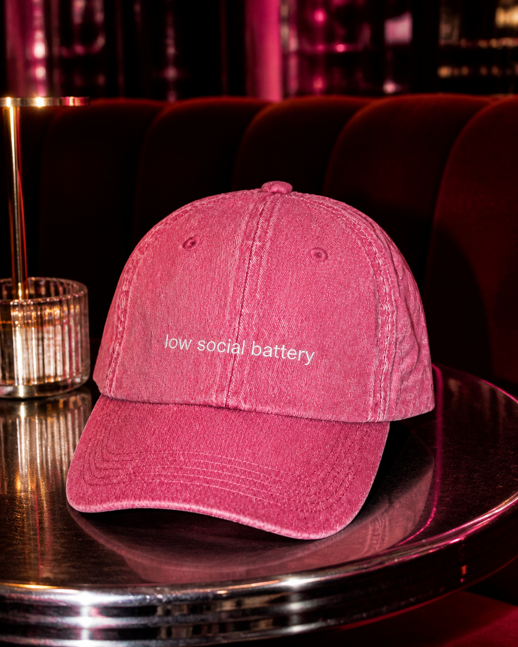 Low Social Battery cap in dark pink — washed cotton dad hat with “low social battery” embroidered in white, worn