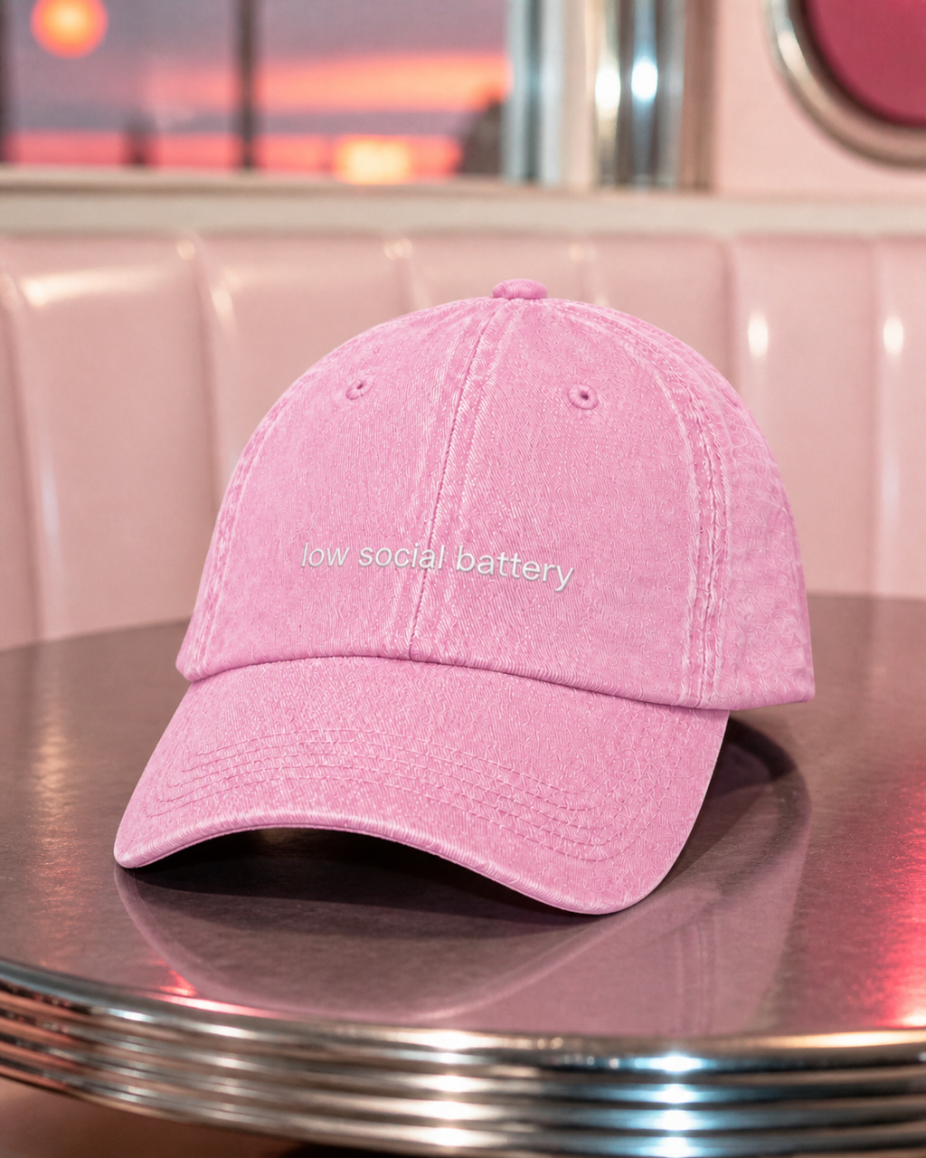 Low Social Battery cap in baby pink — washed cotton dad hat with “low social battery” embroidered in white, worn