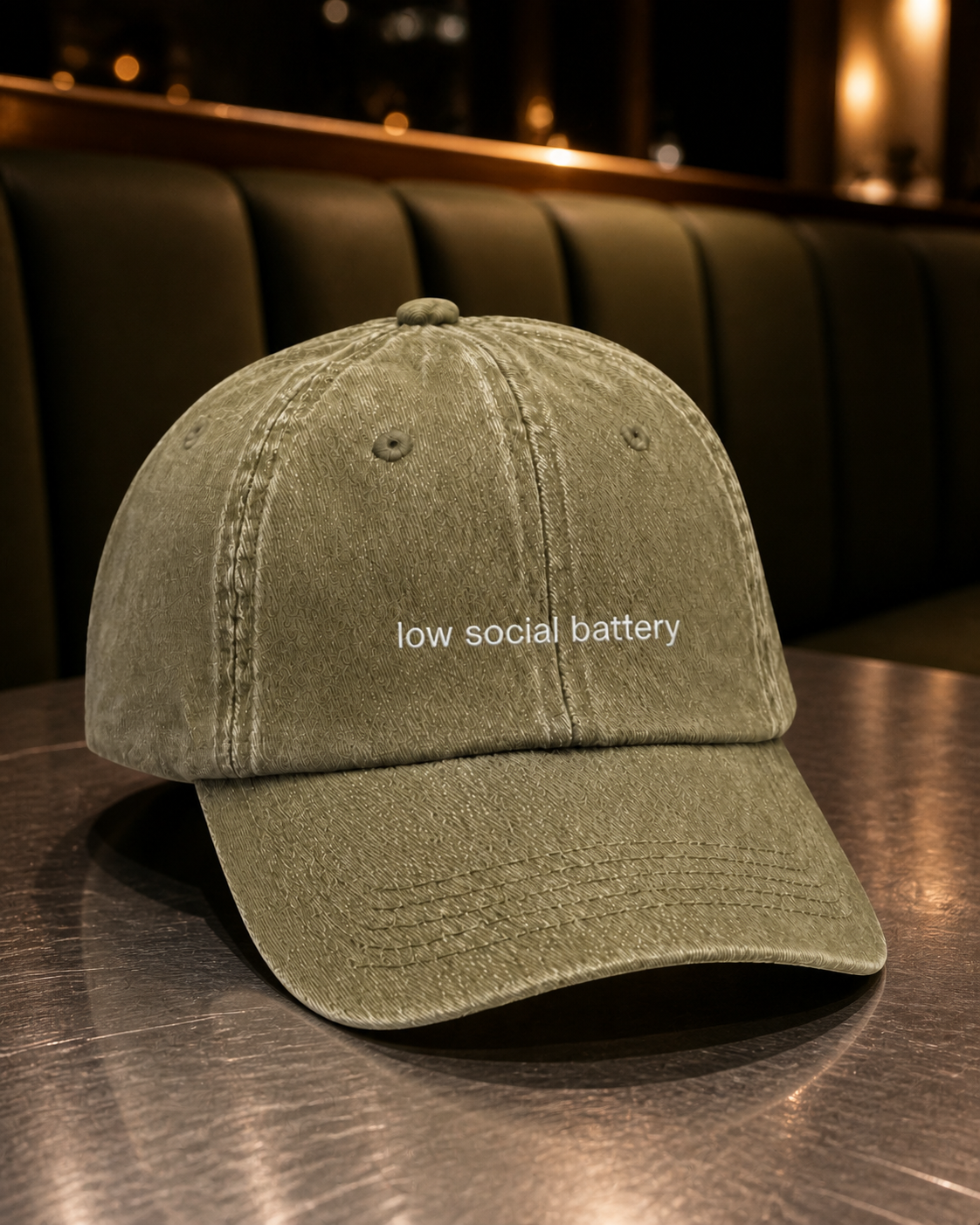 Low Social Battery cap in olive green — washed cotton dad hat with “low social battery” embroidered in white, worn