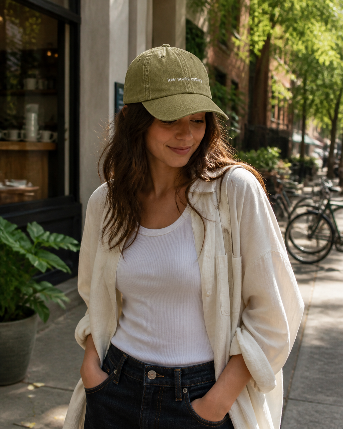 Low Social Battery cap in olive green — washed cotton dad hat with “low social battery” embroidered in white, worn