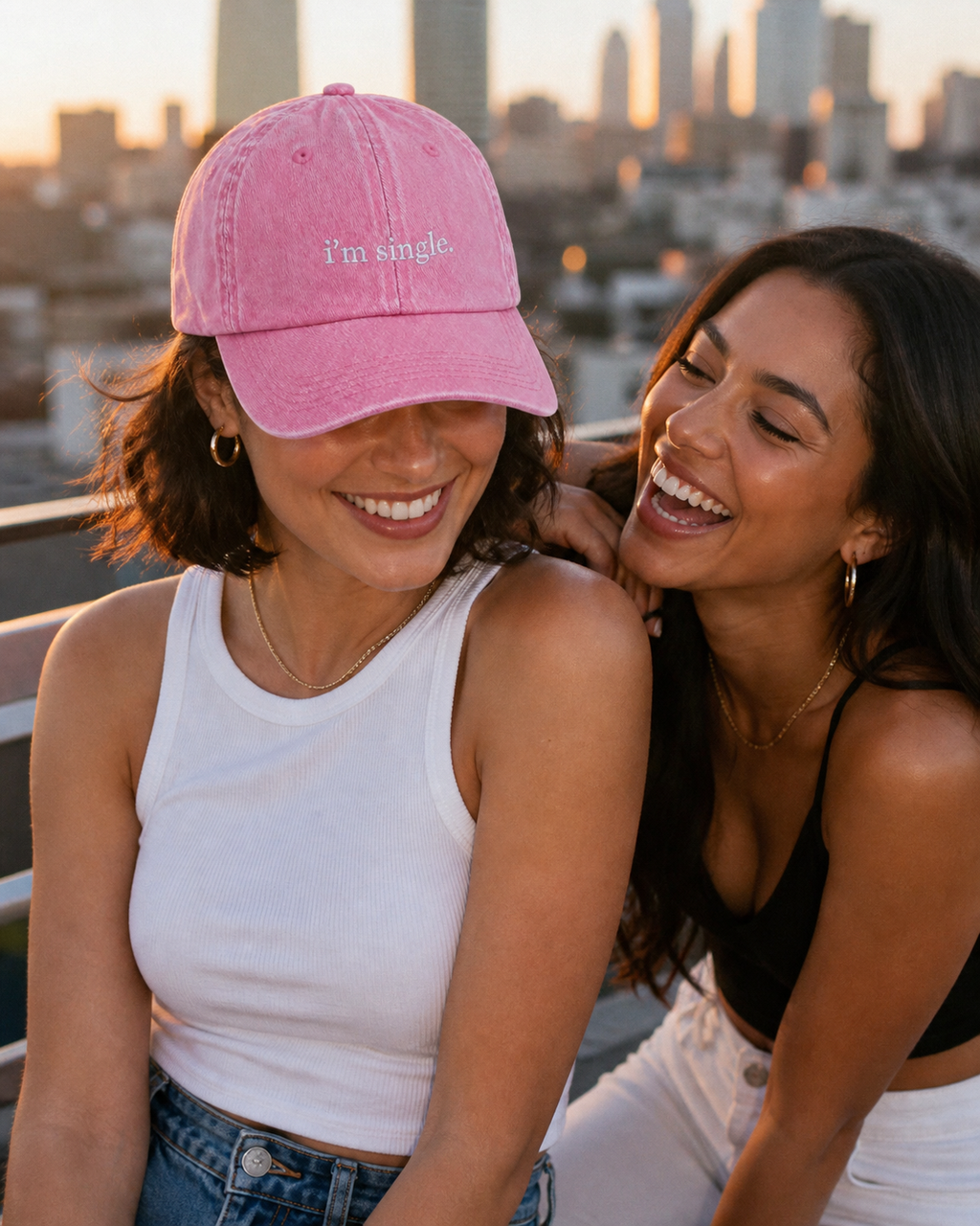 I'm Single cap in baby pink — washed cotton dad hat with “i'm single.” embroidered in white, worn