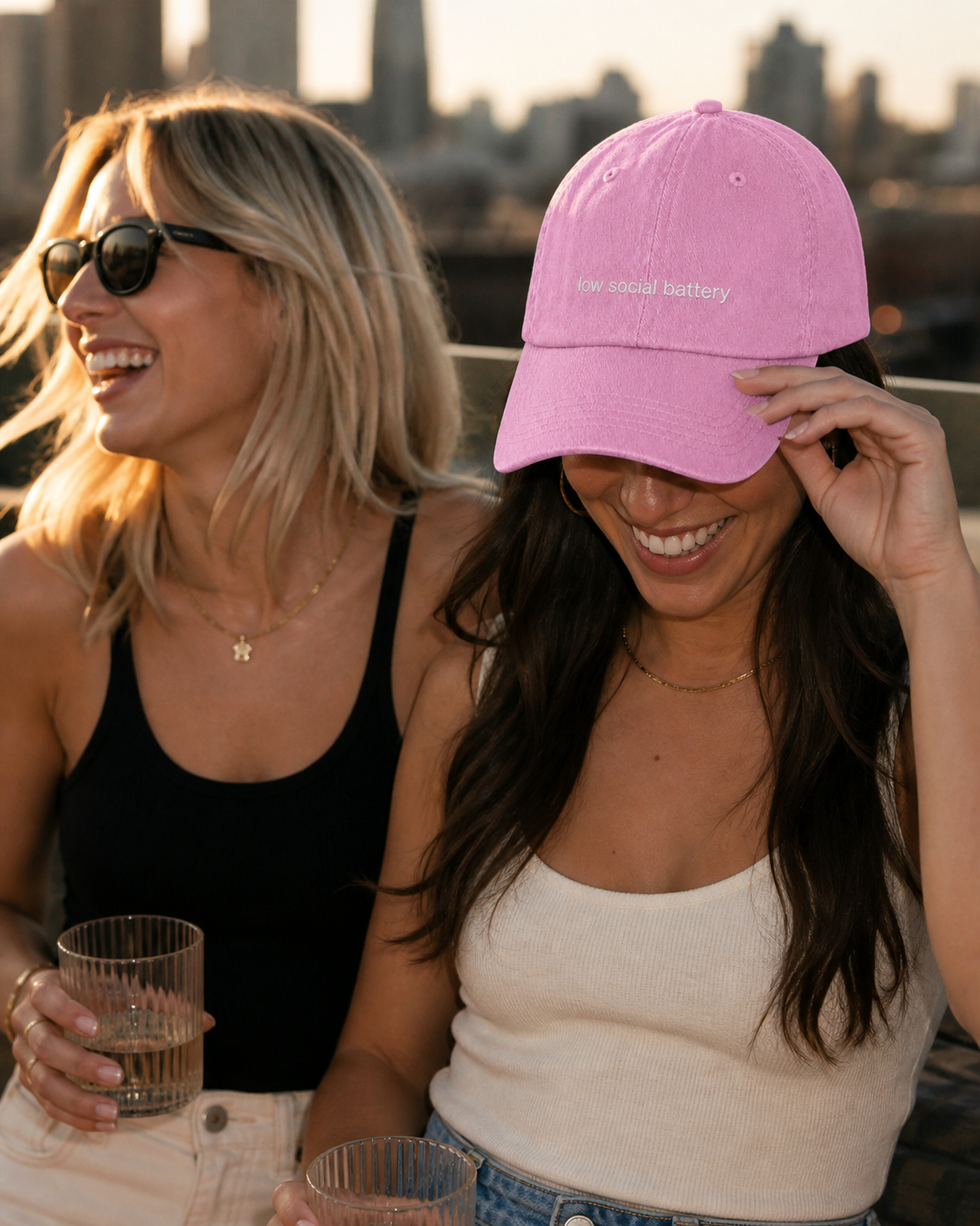 Low Social Battery cap in baby pink — washed cotton dad hat with “low social battery” embroidered in white, worn