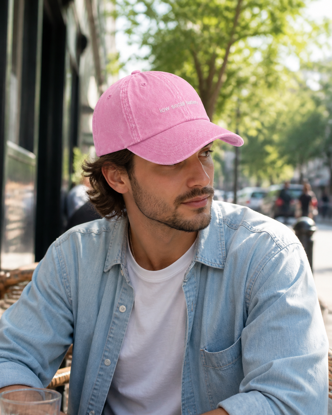 Low Social Battery cap in baby pink — washed cotton dad hat with “low social battery” embroidered in white, worn