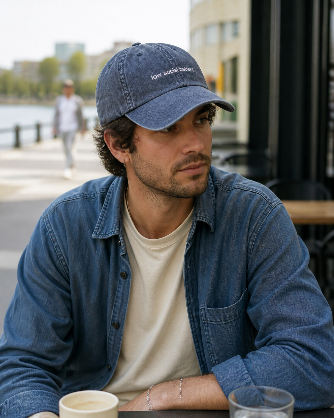Low Social Battery cap in navy — washed cotton dad hat with “low social battery” embroidered in white, worn