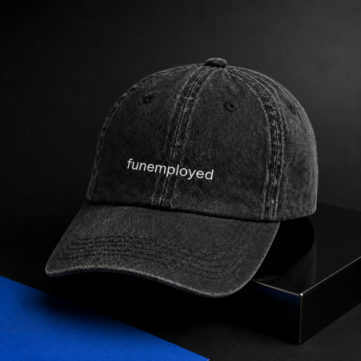 Funemployed cap in black — washed cotton dad hat with “funemployed” embroidered in white, product shot