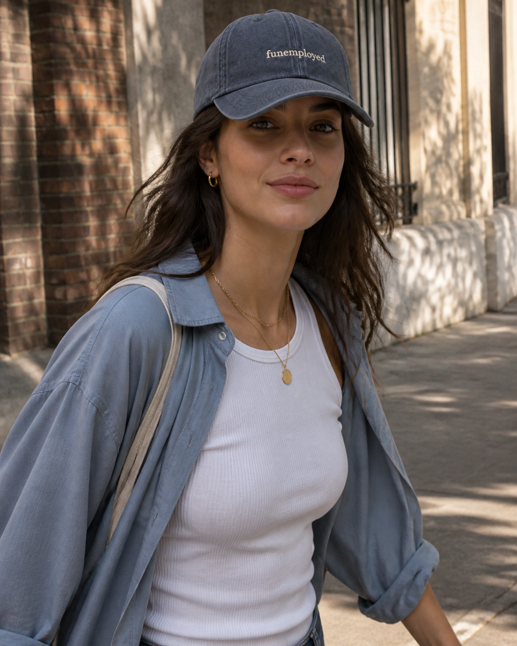 Funemployed cap in navy — washed cotton dad hat with “funemployed” embroidered in white, worn