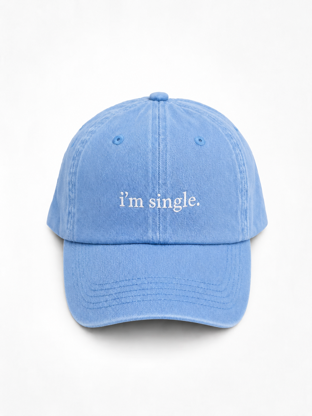 A light blue washed cotton baseball cap with the phrase 'i'm single.' embroidered in white script across the front, shown against a plain white background.