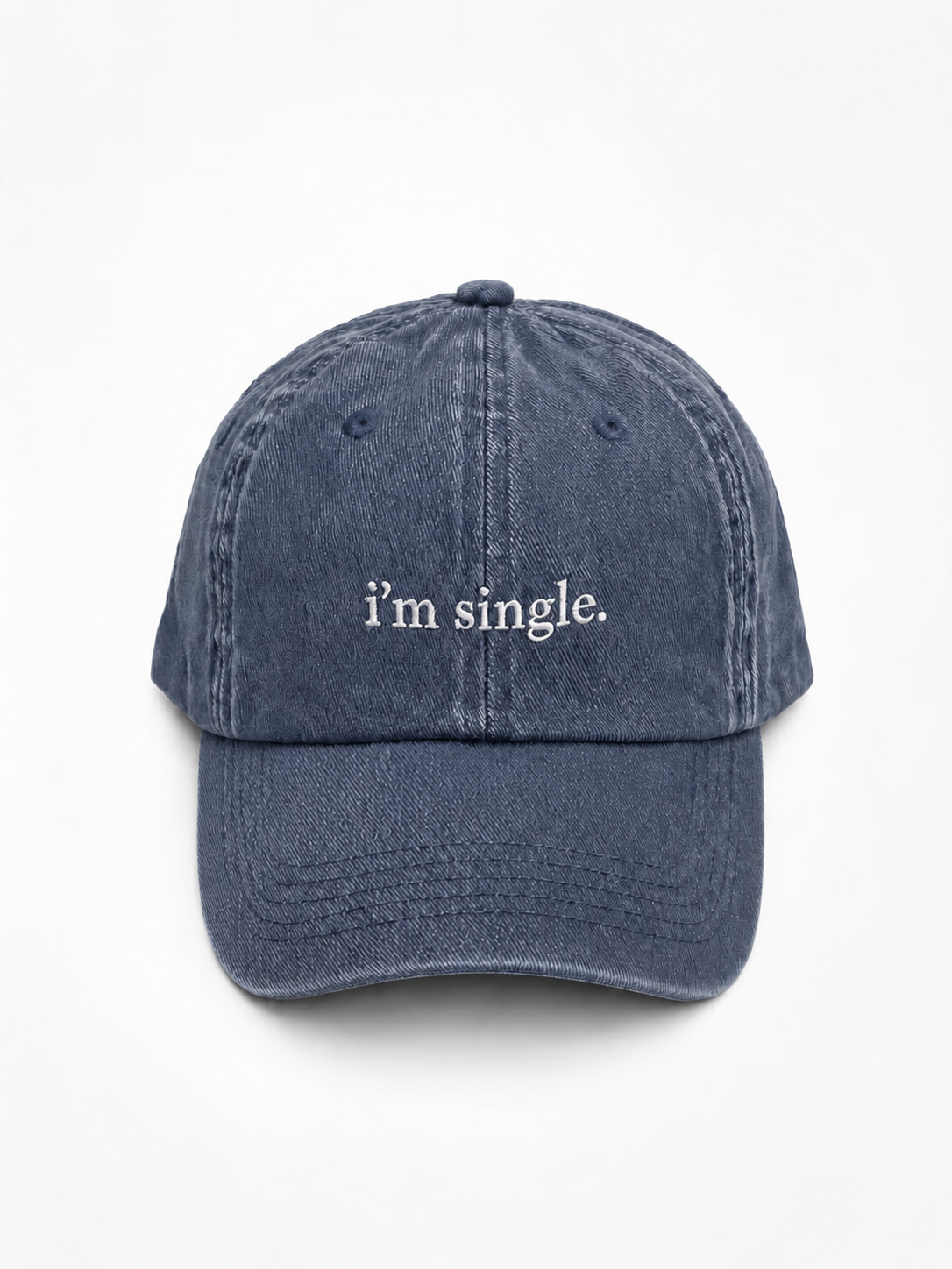 A washed navy blue baseball cap with the phrase 'i'm single.' embroidered in white serif text on the front, shown against a plain white background.