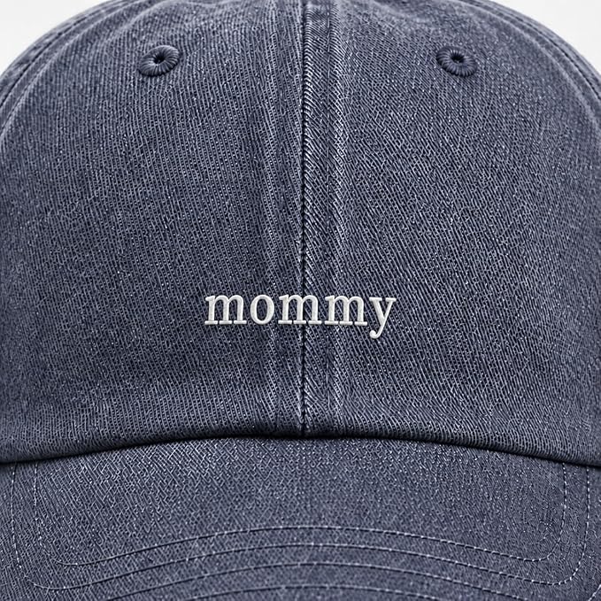 Close-up of a dark navy blue denim-style baseball cap with the word 'mommy' embroidered in white lowercase letters on the front.