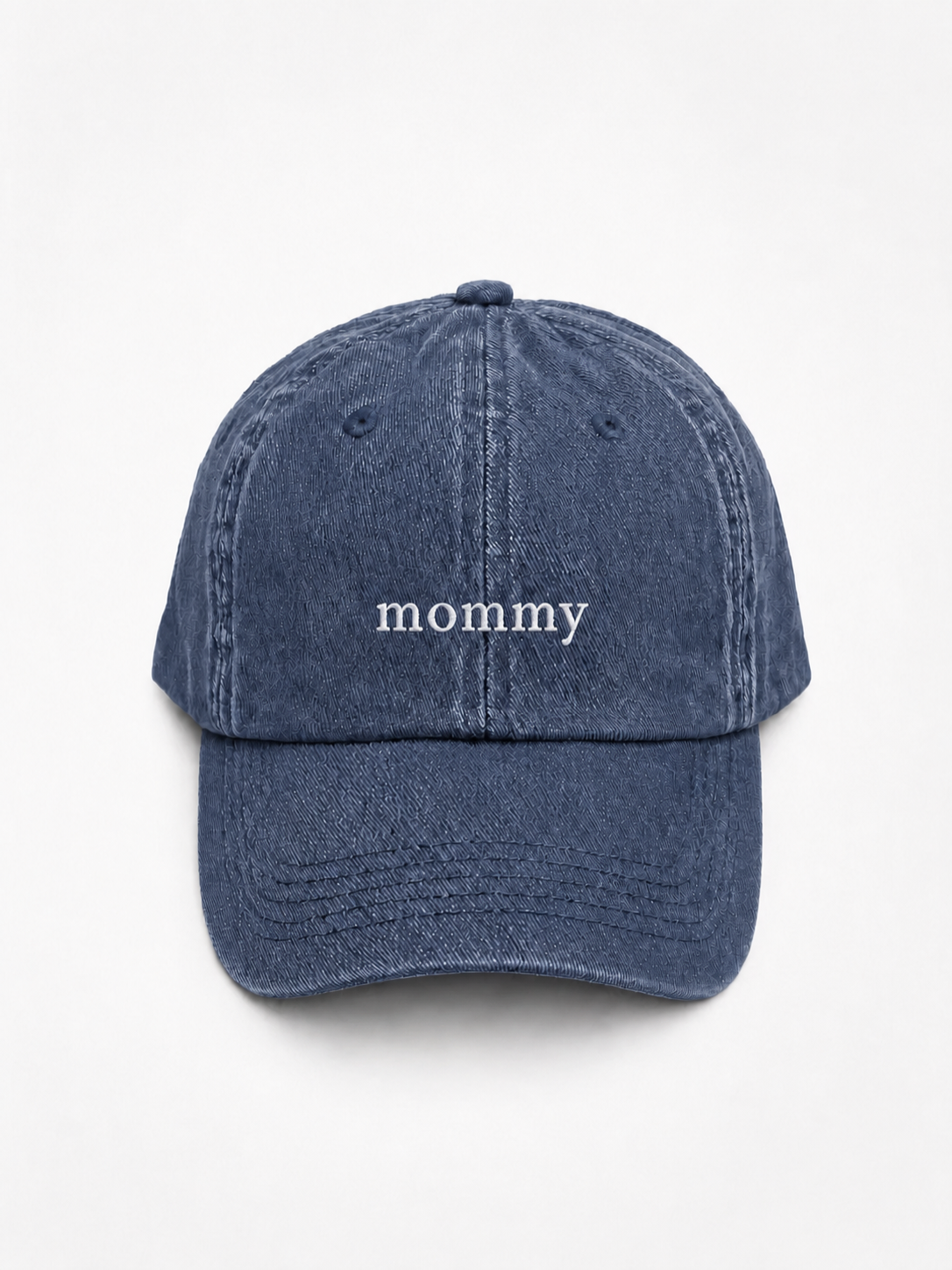 A blue denim baseball cap with the word 'mommy' embroidered in white lowercase letters on the front, shown against a plain white background.