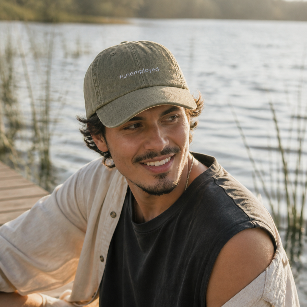 Funemployed cap in olive green — washed cotton dad hat with “funemployed” embroidered in white, worn