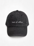 A washed black baseball cap with the phrase 'i'm single.' embroidered in white on the front, shown against a plain white background.