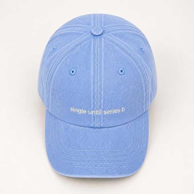 A light blue cotton baseball cap with 'single until series b' embroidered in white on the front, shown against a plain off-white background.