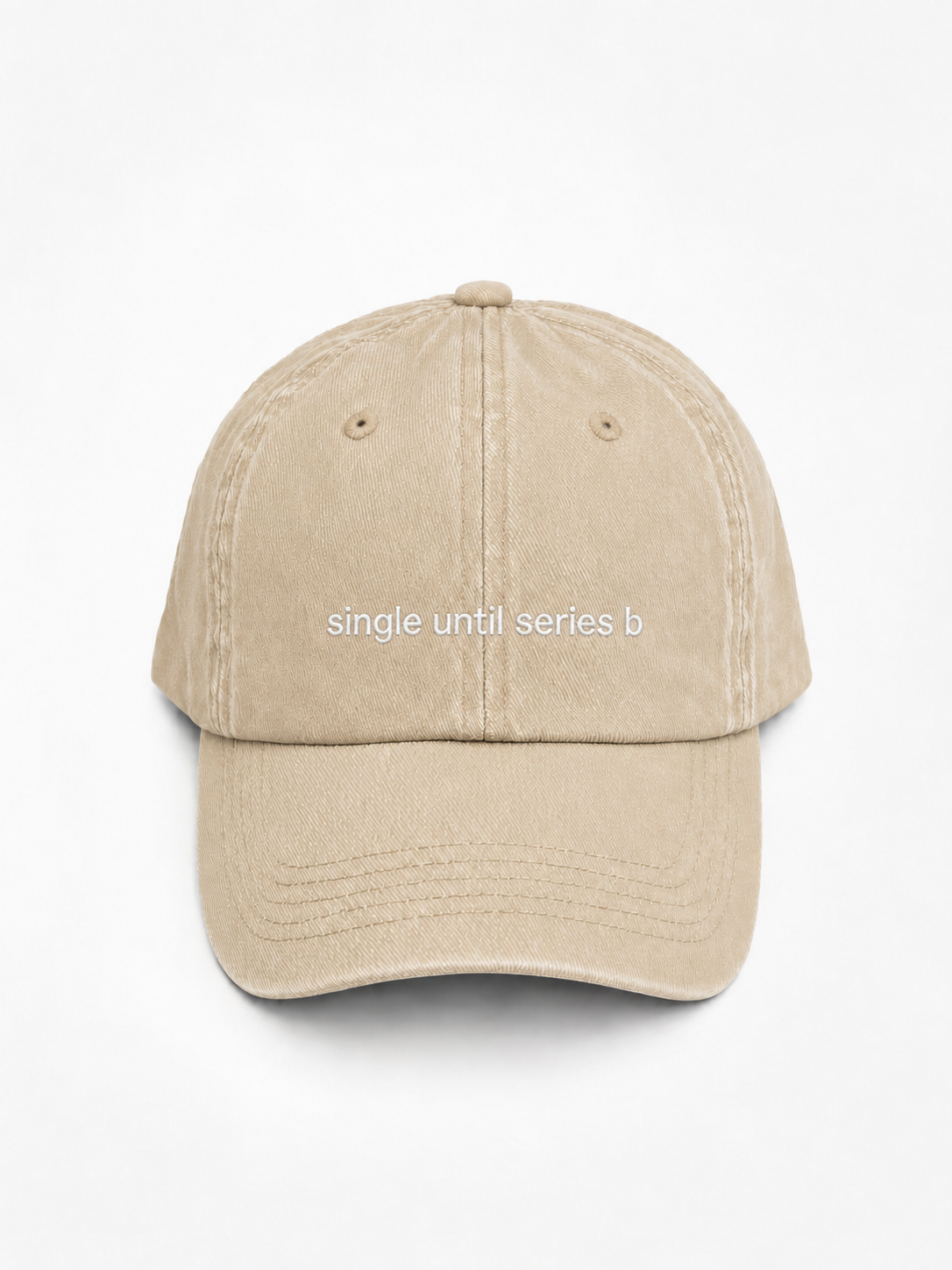 Single Until Series B cap in beige — washed cotton dad hat with “single until series b” embroidered in white, product shot