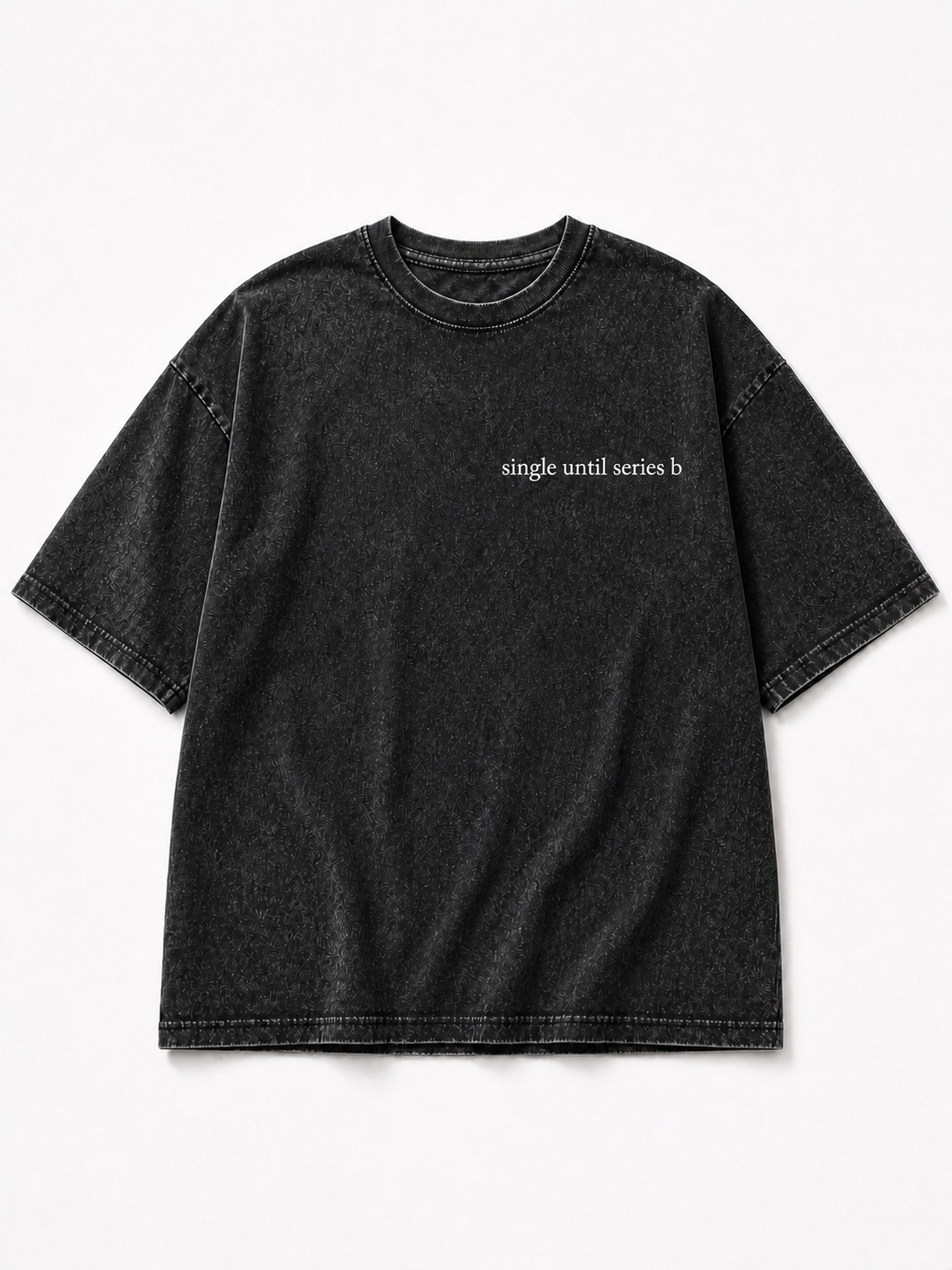 A washed black short-sleeve t-shirt with the phrase 'single until series b' printed in small white text on the left chest, displayed flat against a light gray background.