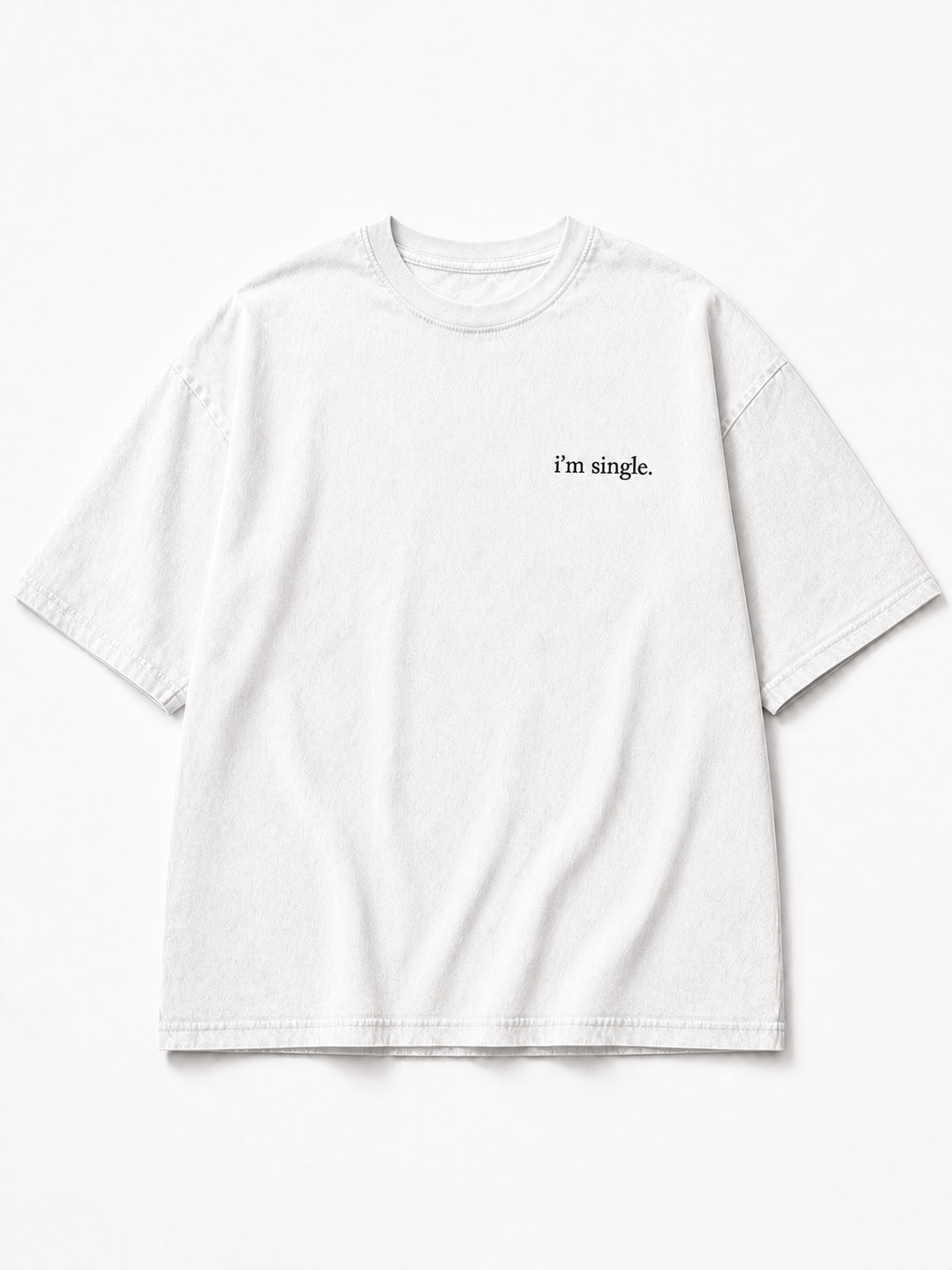 A white short-sleeve crewneck t-shirt with the text 'i'm single.' printed in black on the left chest, displayed flat against a clean white background.